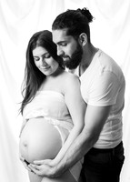 Mother & father cradle baby bump