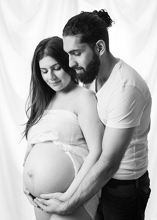 Mother & father cradle baby bump
