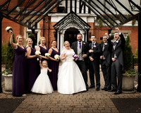 A bridal party cheer in the front glass porch of the Berystede Ascot