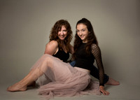 Mother and teenage daughter photographed in a studio