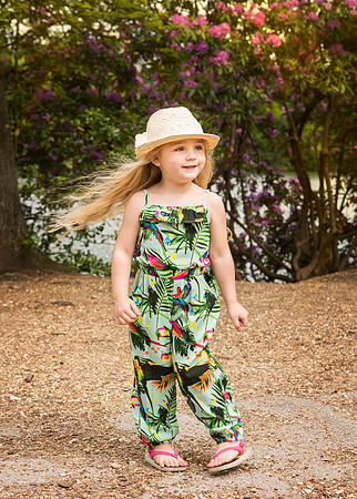 Child model photographed outdoors in summer wear photoshoot