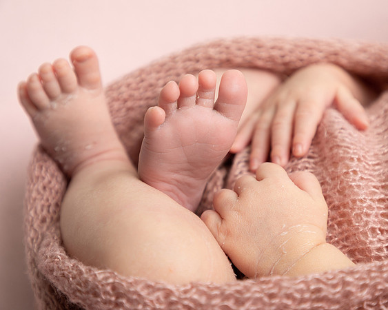 Close-up of newborn babies hands and feet