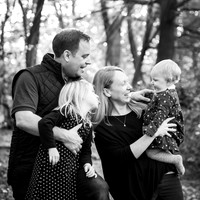 Family mess around during outdoor photo session