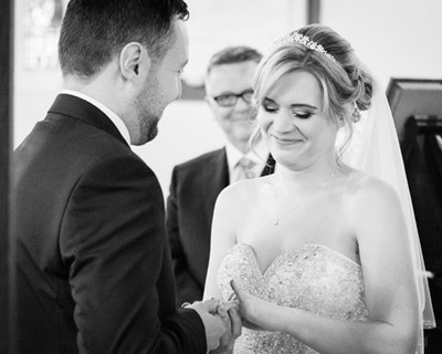 Couple exchange rings during their wedding ceremony in Windsor