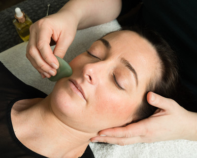 Use of GuaSha during Zone Face Lift facial reflexology treatment