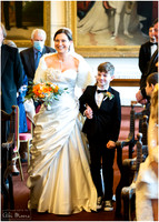 A bride is walked down the aisle by her son at Windsor's Guildhall