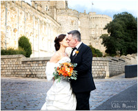 Bride & groom kiss in front of Windsor Castle on a wintery day