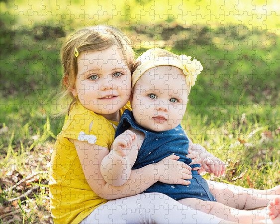 Photo of two young girls taken in summer, presented as a jigsaw