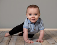 Six month old baby boy about to crawl