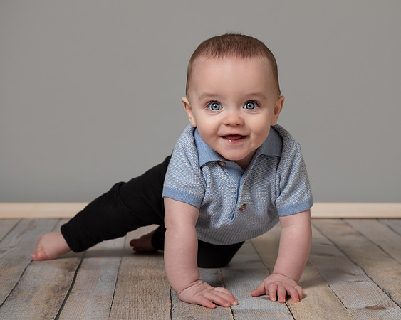 Six month old baby boy about to crawl
