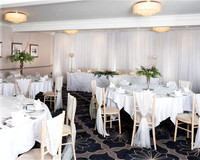 A room in Windsor's Castle Hotel set up for a small wedding reception