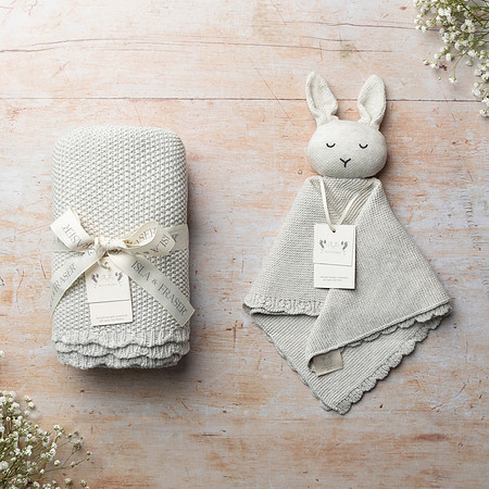 Baby blanket and baby comfort both knitted in grey yarn