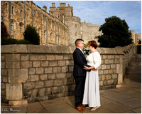 Bride & Groom look lovingly at each other outside Windsor Guildhall