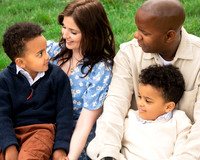 Close-up of a tender moment between parents and their two young sons