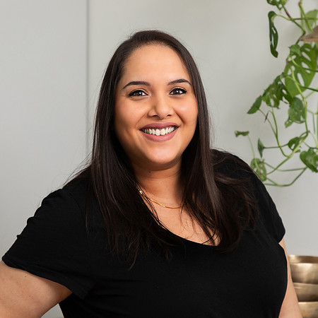 Natural on-location headshot of a woman smiling at the camera
