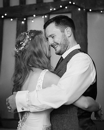 Bride and groom share a tender moment during their first dance