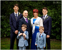 Bride and groom photographed with their sons in the grounds of Berystede Ascot