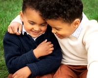 Two brothers hug and laugh together