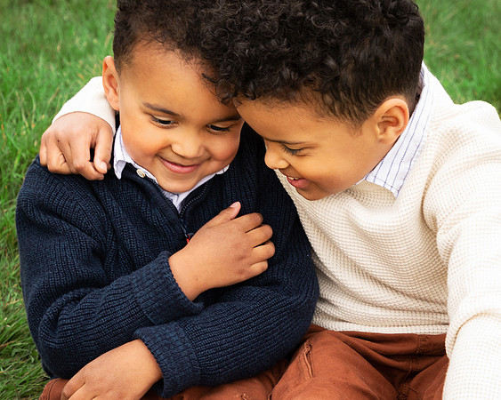 Two brothers hug and laugh together