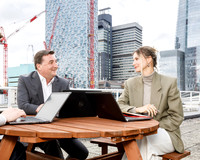 People discussing work in a meeting